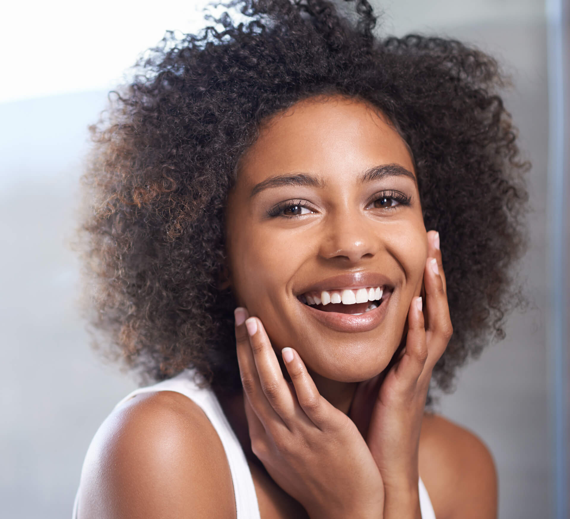 Beautiful Smiling woman hands under chin