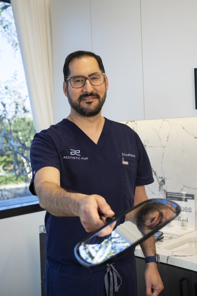  Dr. Luis Macias exemplifying Transaxillary Breast Augmentation proficiency.
